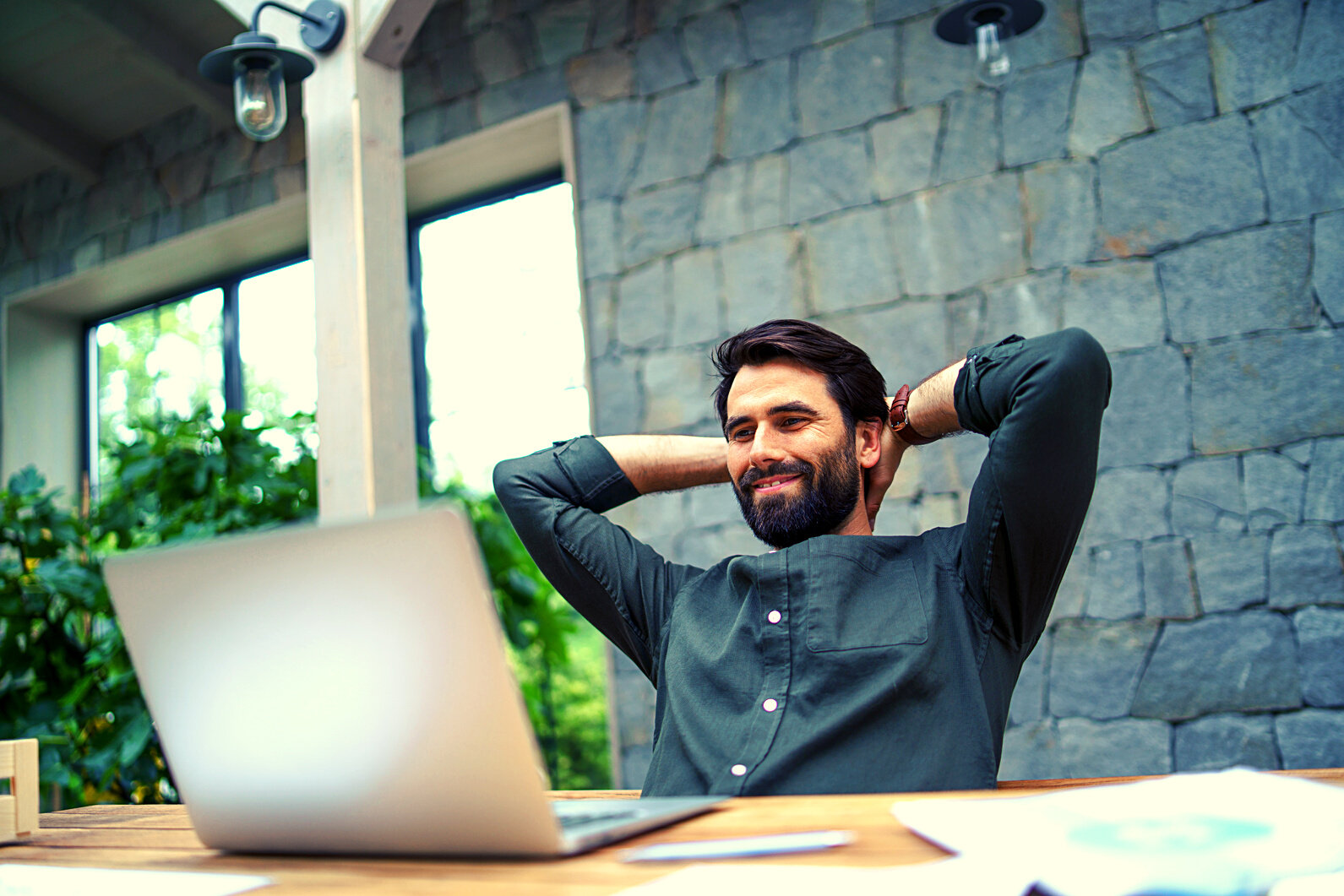 Happy Man Working on Laptop